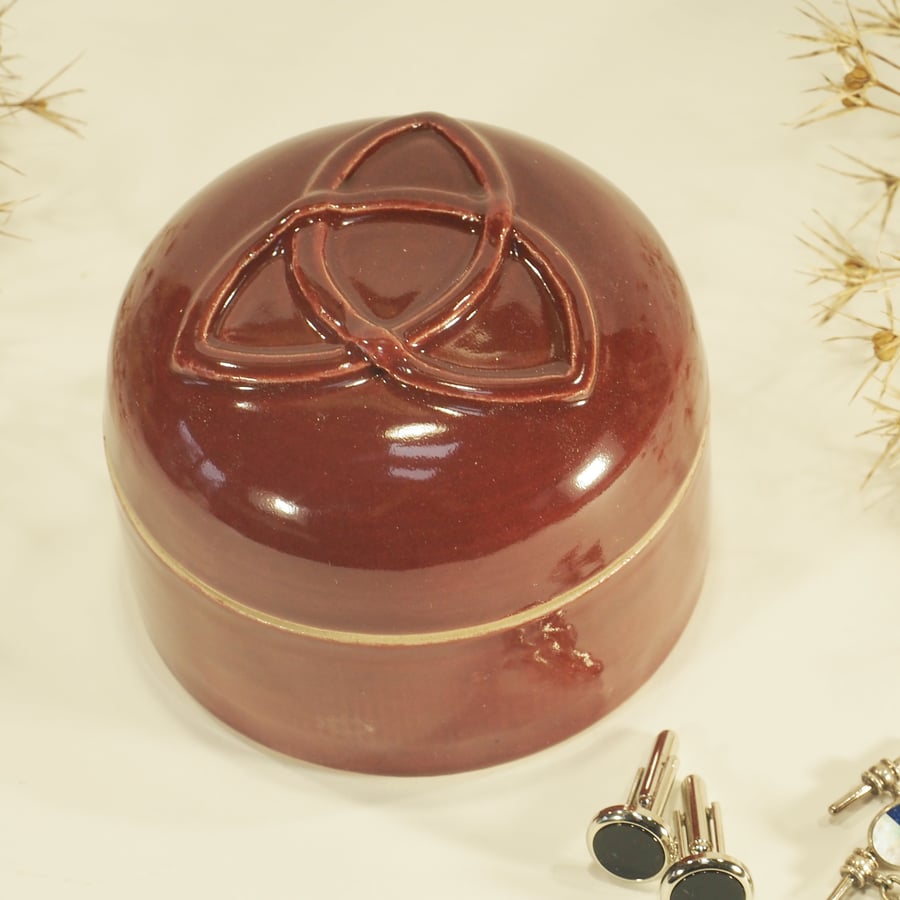 Dark Red lidded pot with Celtic Design