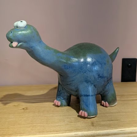 Ceramic blue and green diplodocus, dinosaur ornament 
