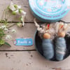 Baby bodkin brooches in vintage tin