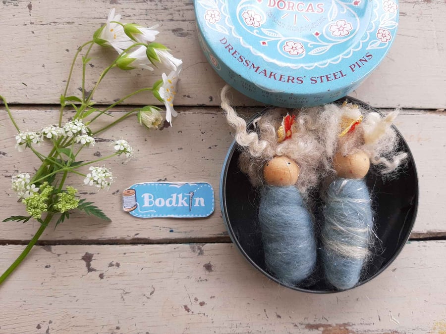 Baby bodkin brooches in vintage tin