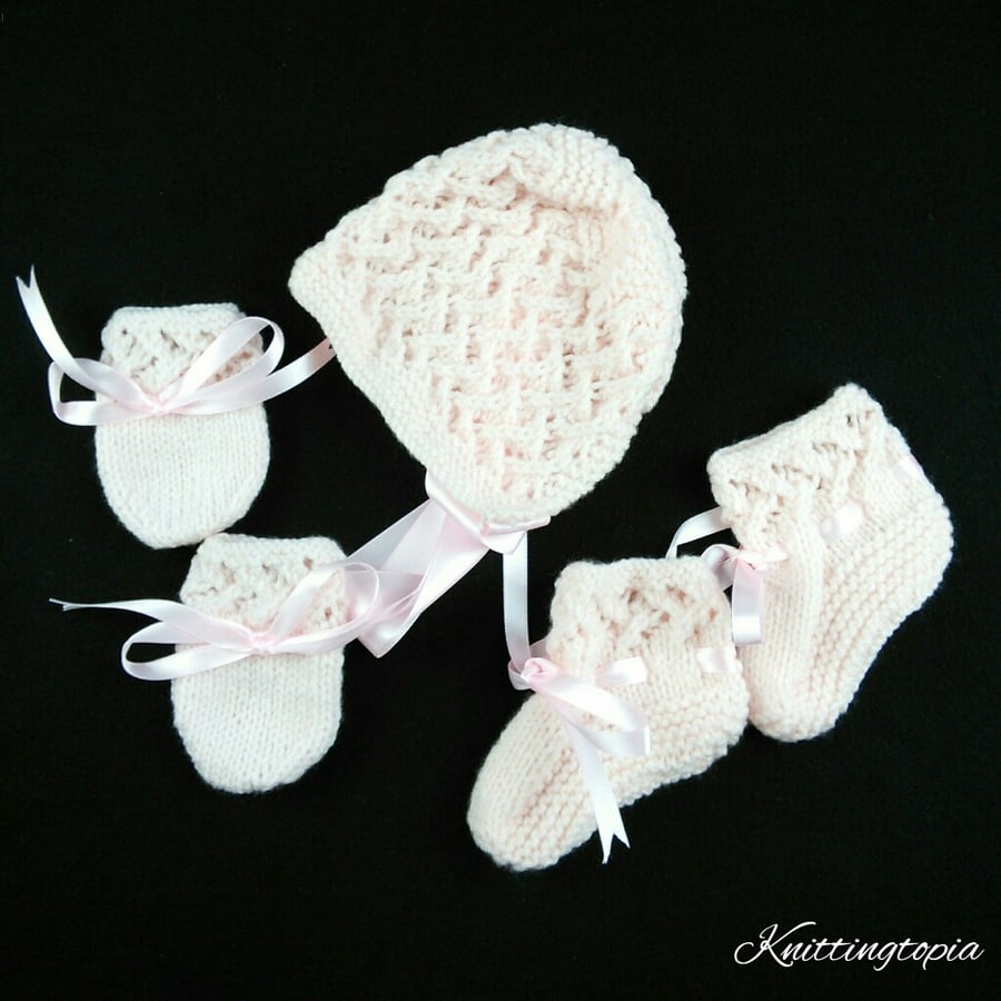 Pale pink hand knitted baby bonnet booties and mittens set to fit 0 - 3 months  