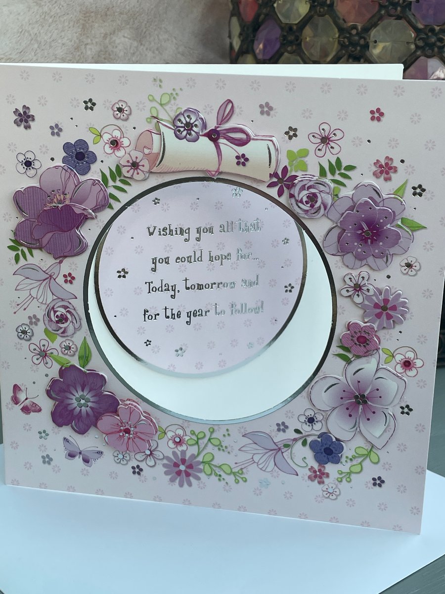 Beautiful layered floral circle aperture birthday card