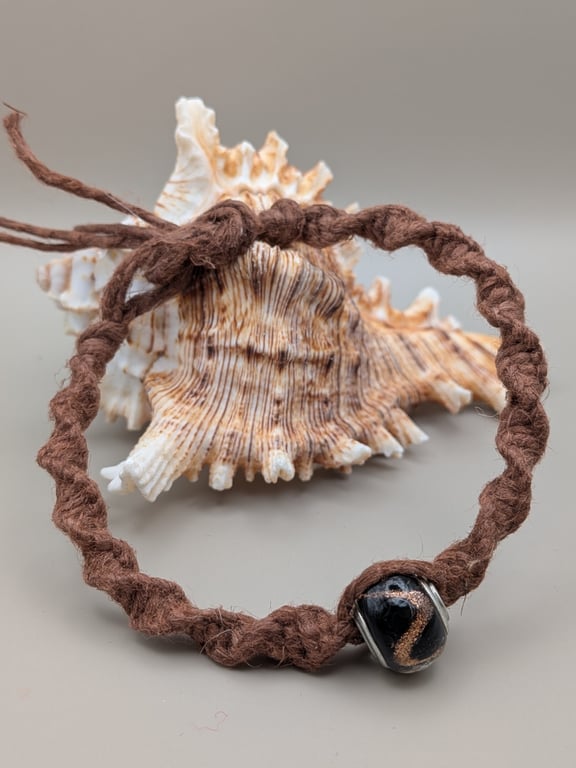 Handmade macrame bracelet with a lamp work glass bead 