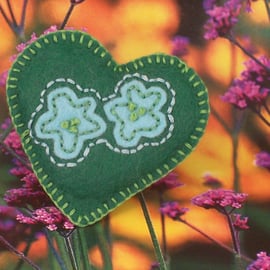 Hand embroidered heart shaped felt brooch in green