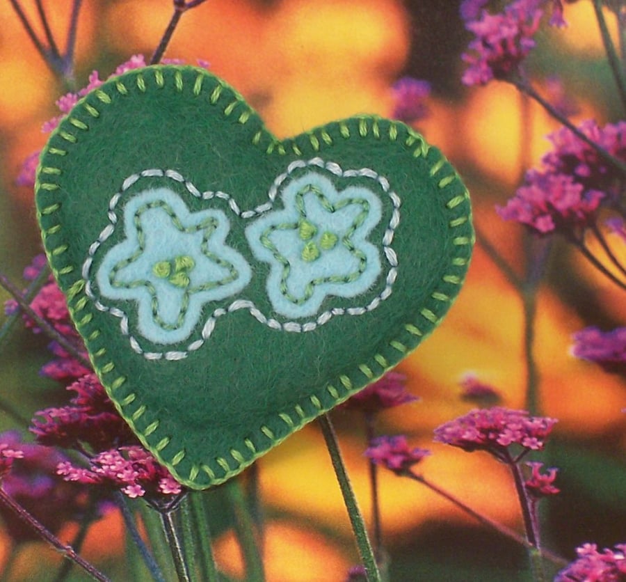 Hand embroidered heart shaped felt brooch in green