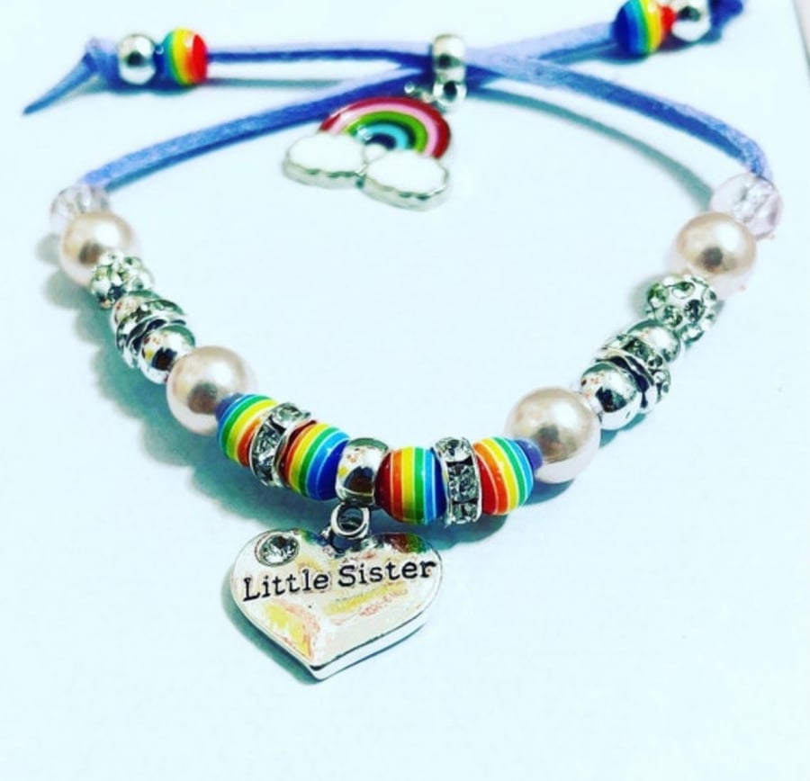 Lilac suede effect corded little sister charm bracelet with rainbow charm 
