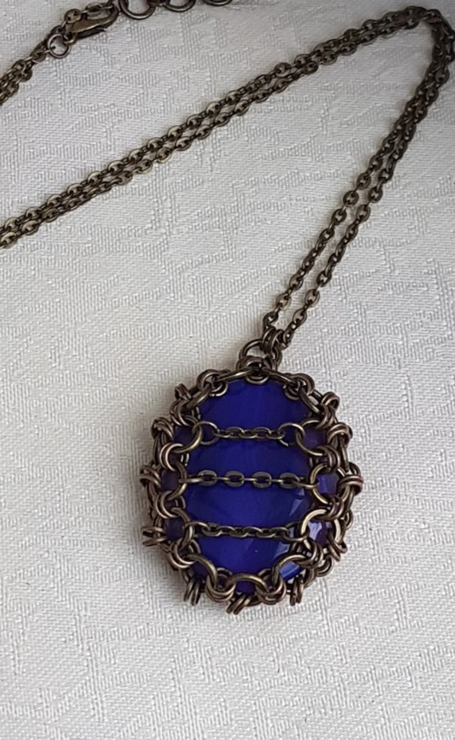 Gorgeous Caged Fire Purple Pendant Necklace.