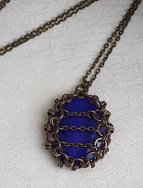 Gorgeous Caged Fire Purple Pendant Necklace.
