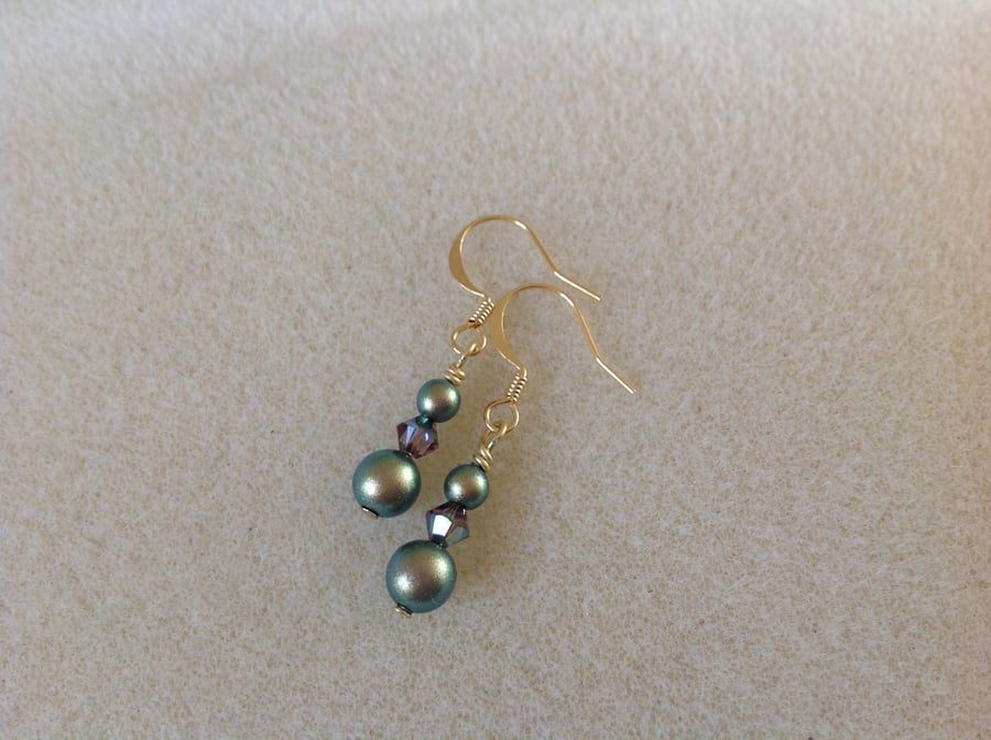 Iridescent green and gold pearl and crystal earrings.