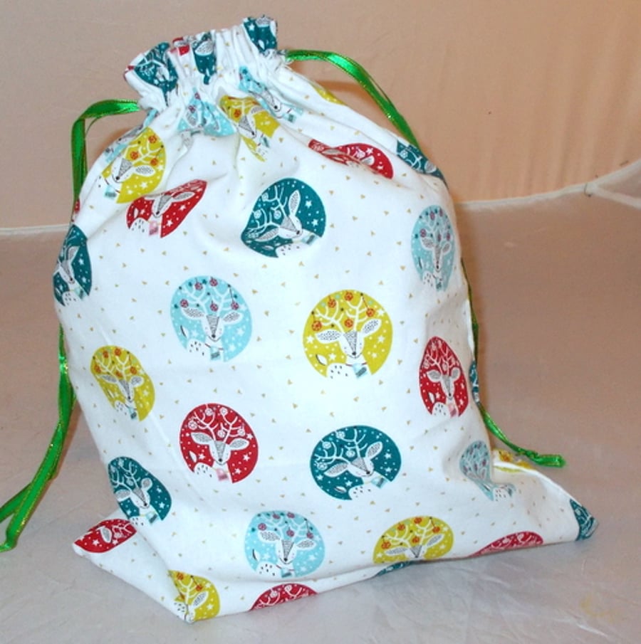 Christmas drawstring bag with printed stag heads.
