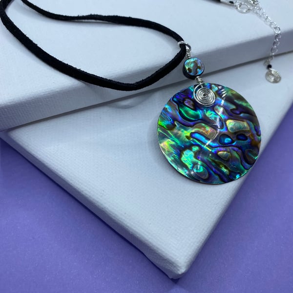 Abalone shell silver plated pendant on black faux suede cord