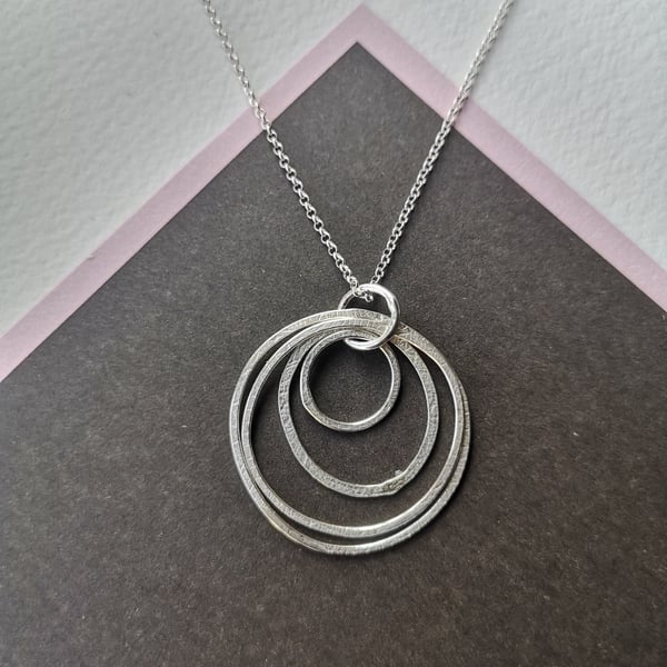Multi-loop silver necklace