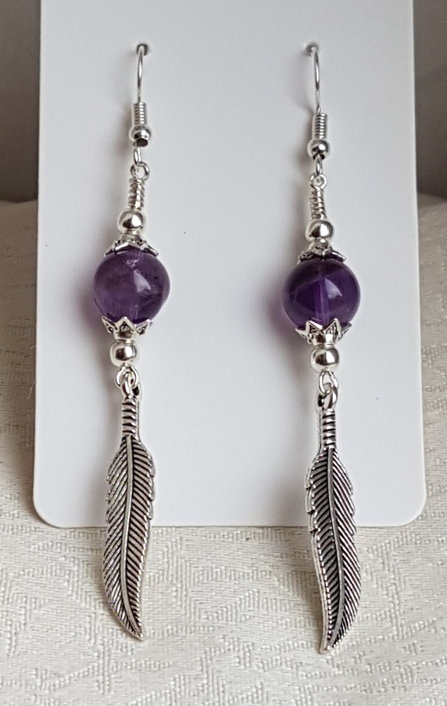 Gorgeous Amethyst Bead and Feather Charm Earrings.