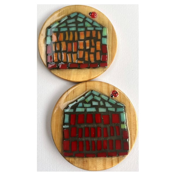 A set of four,resined ceramics 'Beach Hut' themed wooden coasters. 