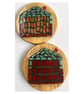 A set of four,resined ceramics 'Beach Hut' themed wooden coasters. 