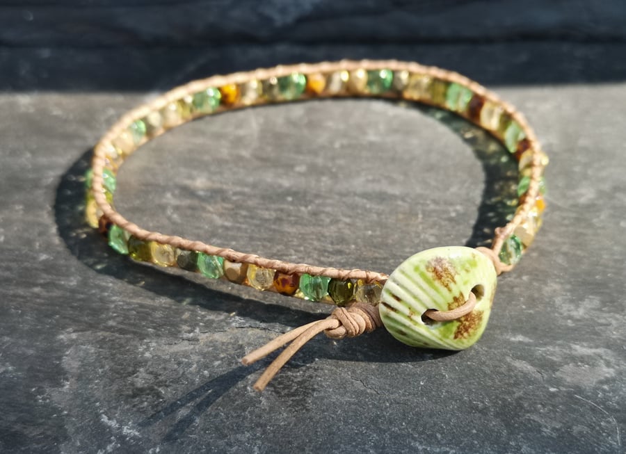 Tan leather bracelet with green ceramic shell button and Czech glass beads