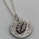 Pure silver necklace with 3D leaf and lovely, textured background. 