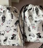 Small cat themed black and white drawstring pouch bag - Image 1