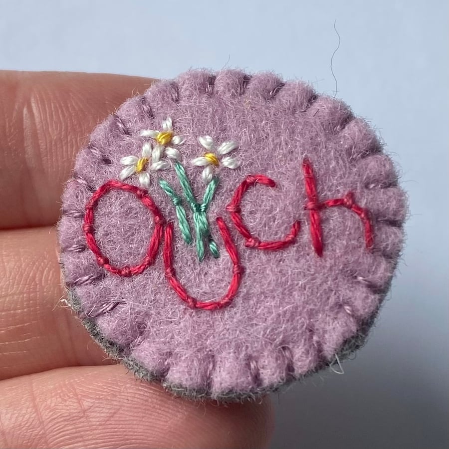 Ouch and daisies lavender wool felt brooch disability mental health awareness 