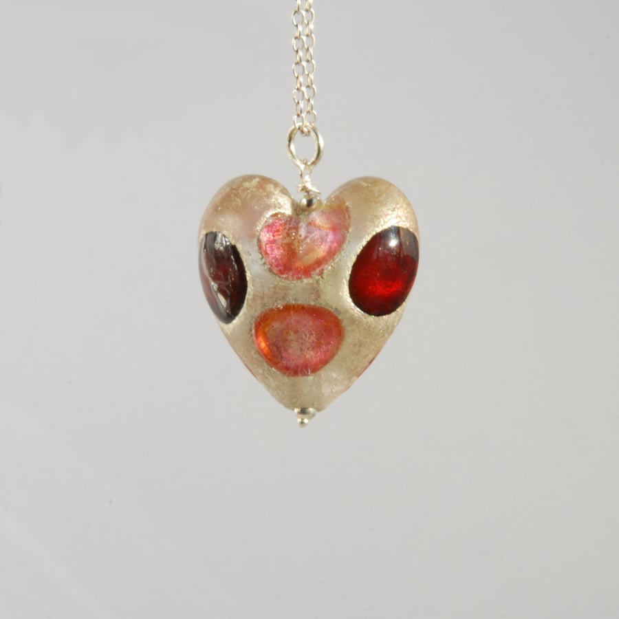 Pink and red white gold foiled murano glass heart pendant with silver chain.