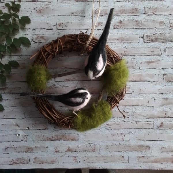 Indoor wreath decoration with needle felted birds .