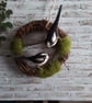 Indoor wreath decoration with needle felted birds .