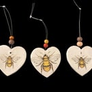 Bee hanging hearts