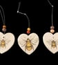 Bee hanging hearts