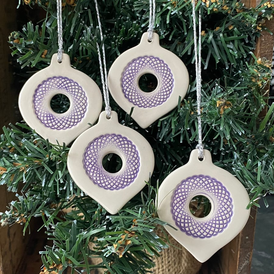 Set of four lightweight ceramic baubles purple