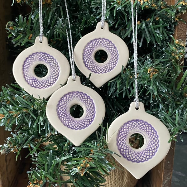Set of four lightweight ceramic baubles purple