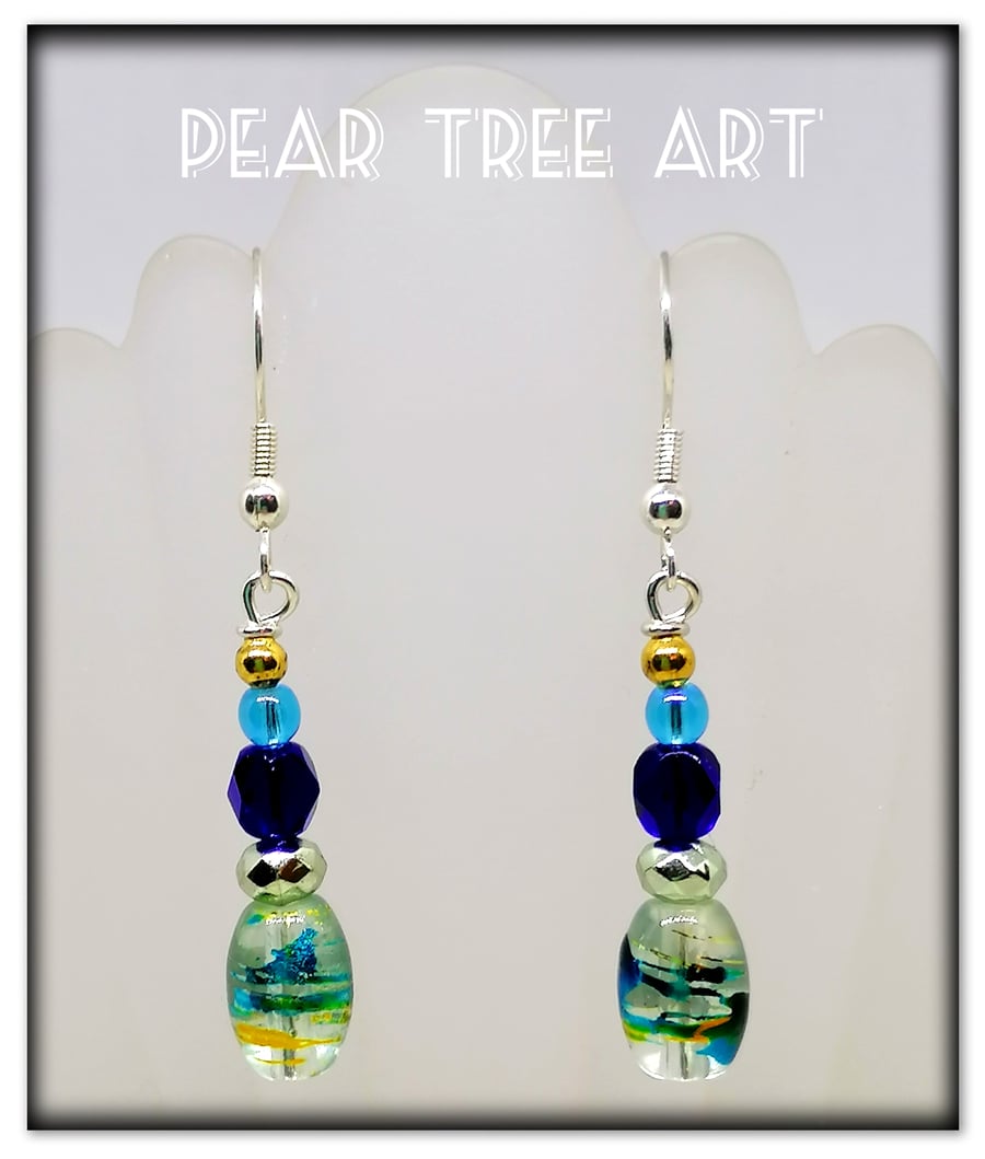 Small glass bead earrings with blue crystal beads  on Silver  plated hooks.