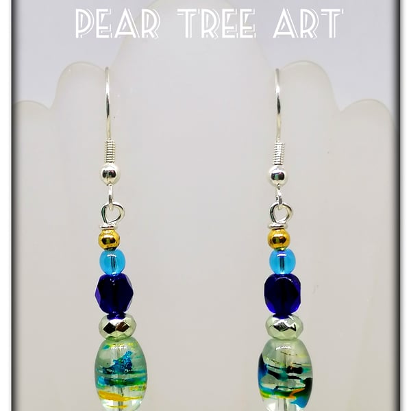 Small glass bead earrings with blue crystal beads  on Silver  plated hooks.
