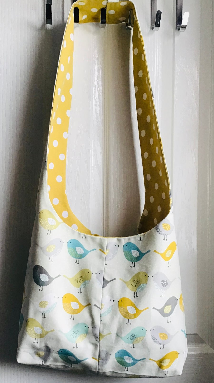 Sling bag reversible with birds.