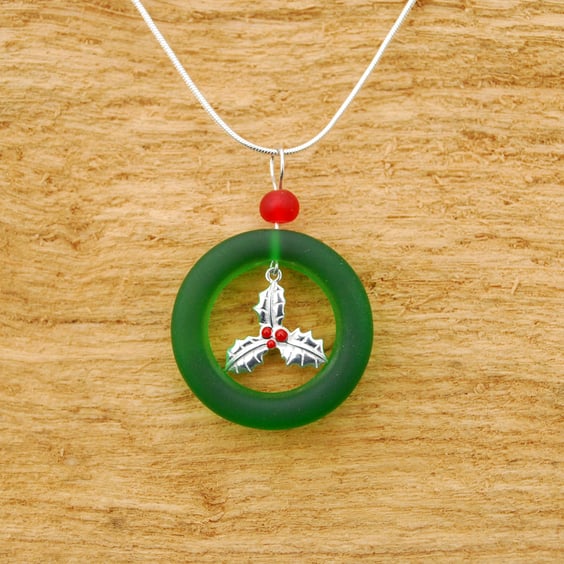 Holly charm in glass ring pendant