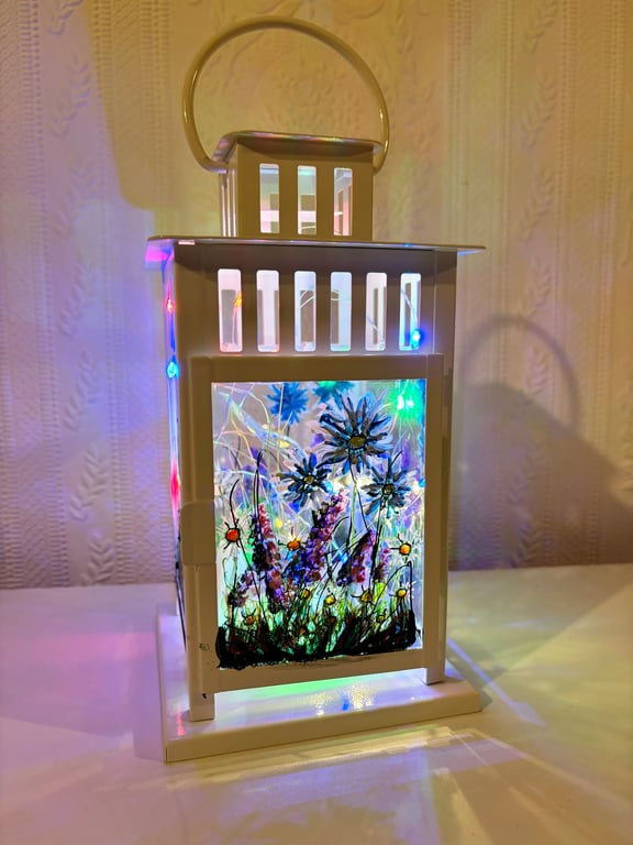 A hand painted and fired metal and glass lantern by Andrew Jenkins 