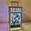 A hand painted and fired metal and glass lantern by Andrew Jenkins 