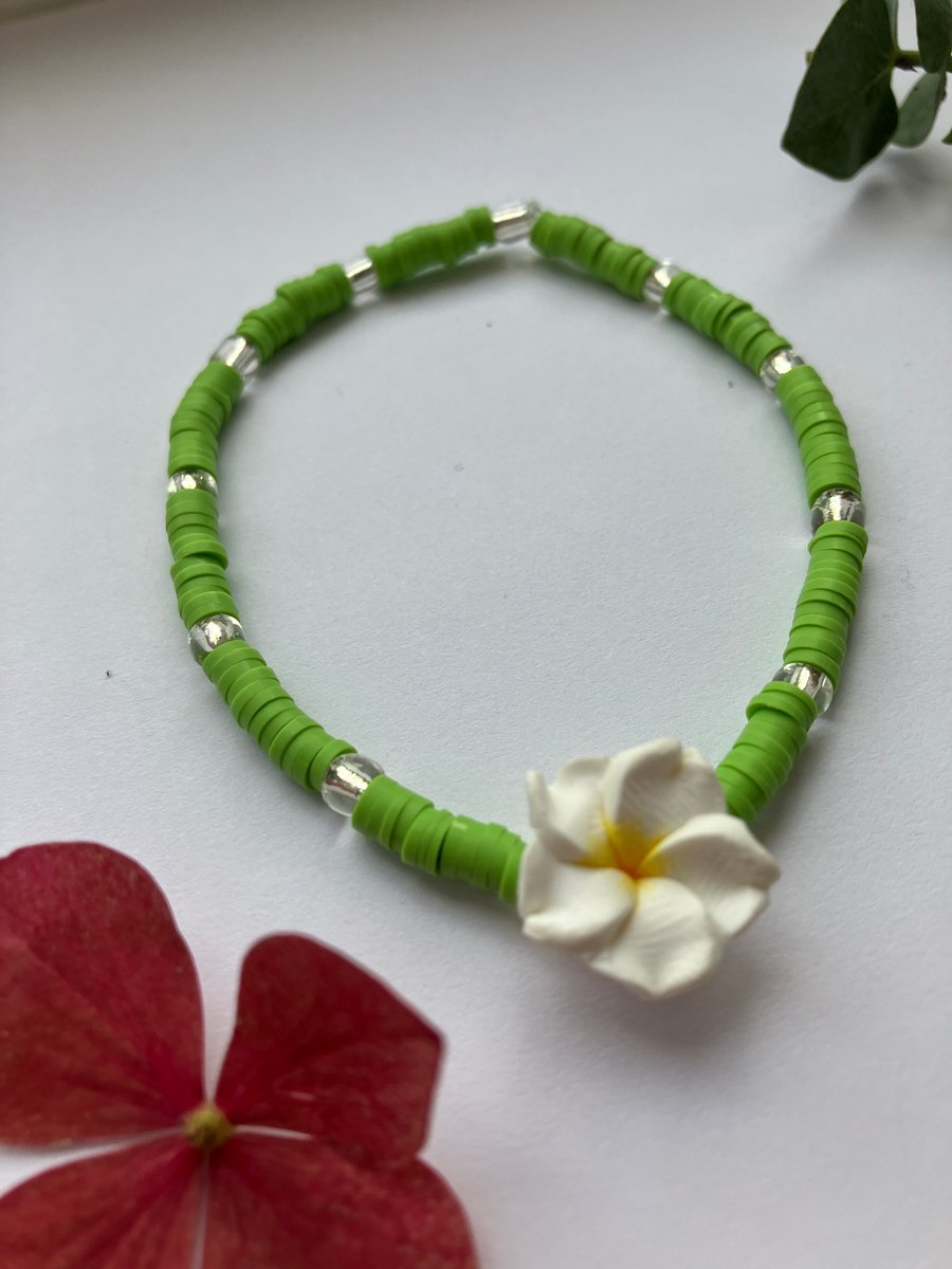 Green clay-bead bracelet with WHITE Frangipani charm