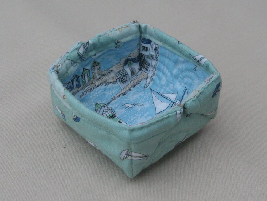 Small Quilted storage box featuring seaside themed and sailboats on light green 