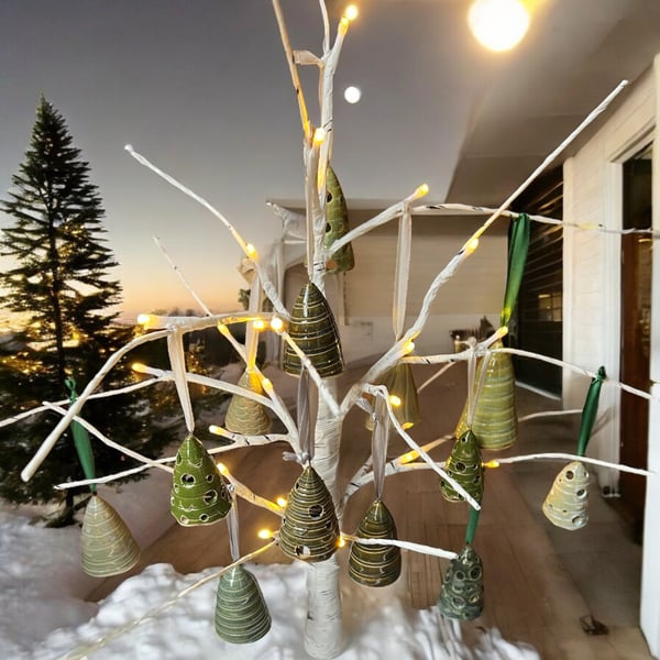 Hand-crafted small christmas tree hanging decorations thrown on pottery wheel