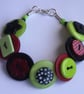 Red, black and lime button bracelet - Image 1