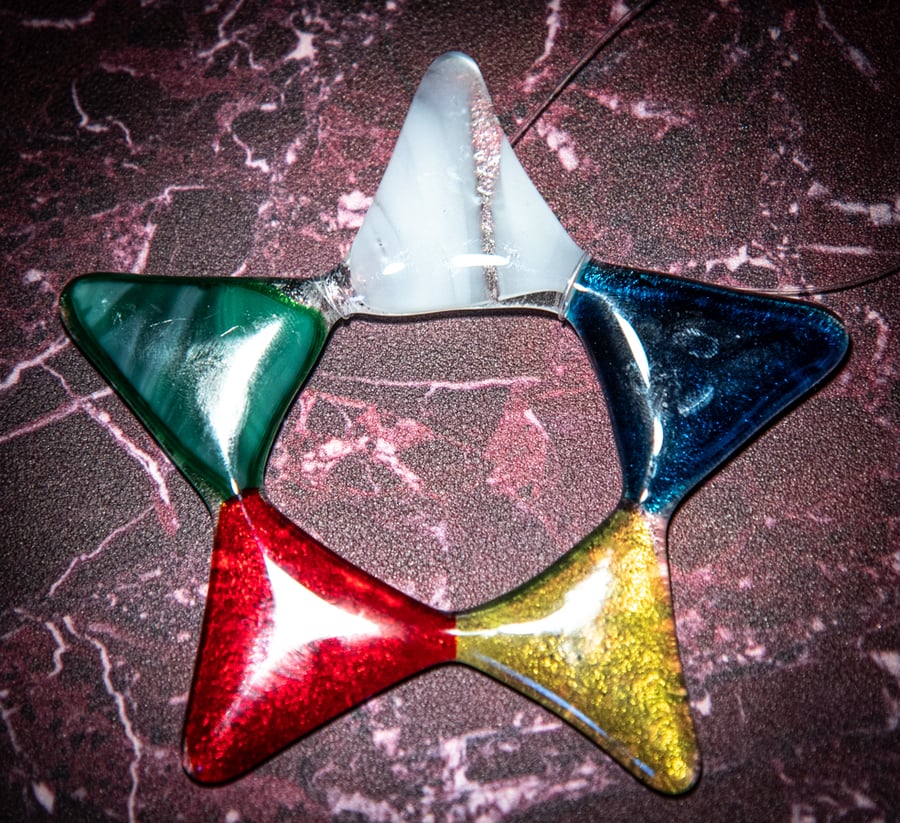 Star shaped light catcher in multi-coloured fused glass
