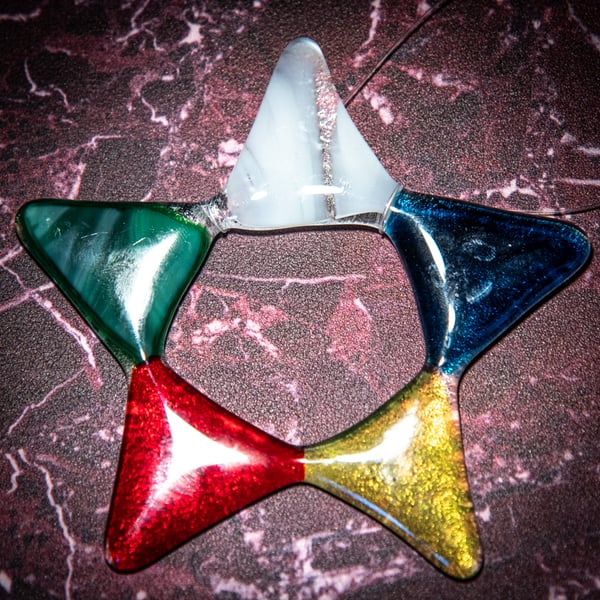 Star shaped light catcher in multi-coloured fused glass