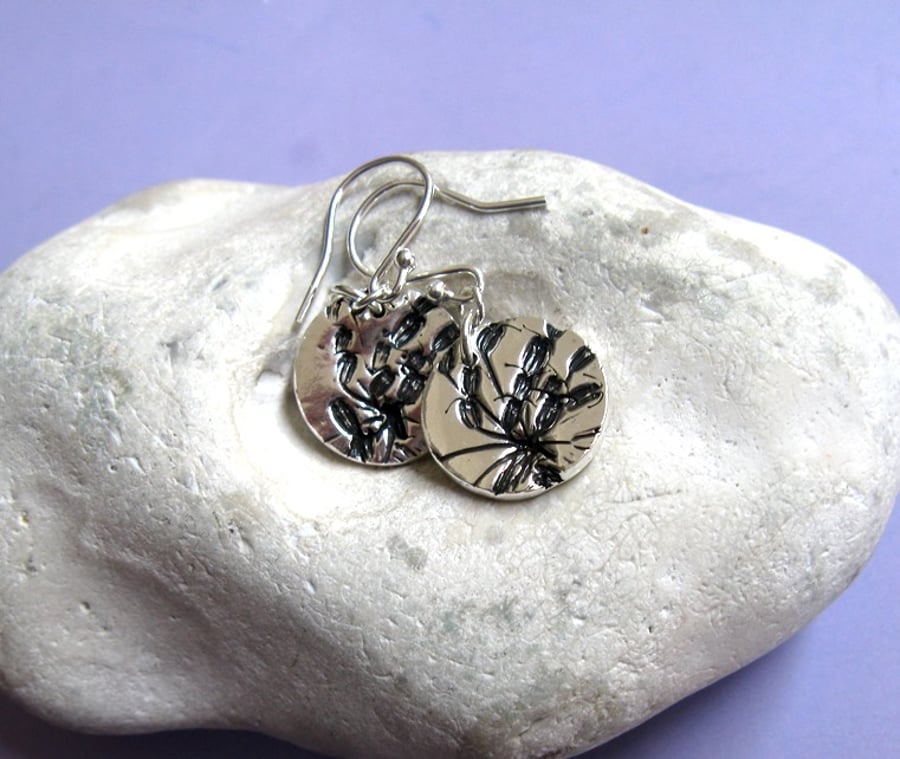 Fine silver disc earrings with clover flower imprint