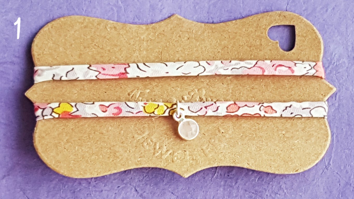 Fabric bracelet with silver charm
