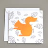 Squirrel in front of black and white leaf pattern blank card.