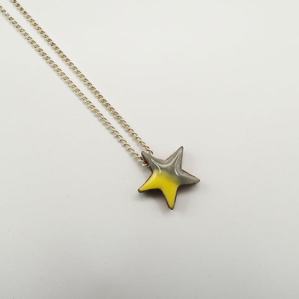 Star necklace on silver chain, yellow grey