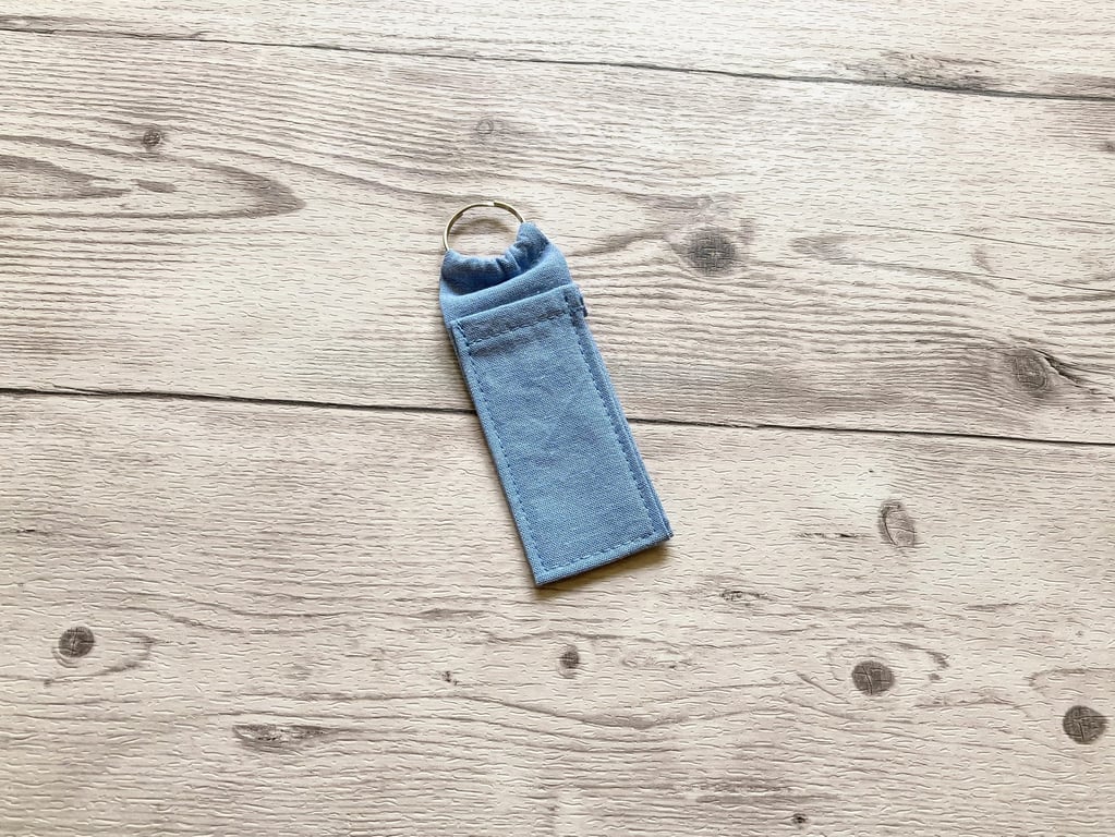 Plain light blue blue lip balm holder. Lipstick cotton fabric keychain.