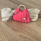 Small ag, key, ear buds, coins holder