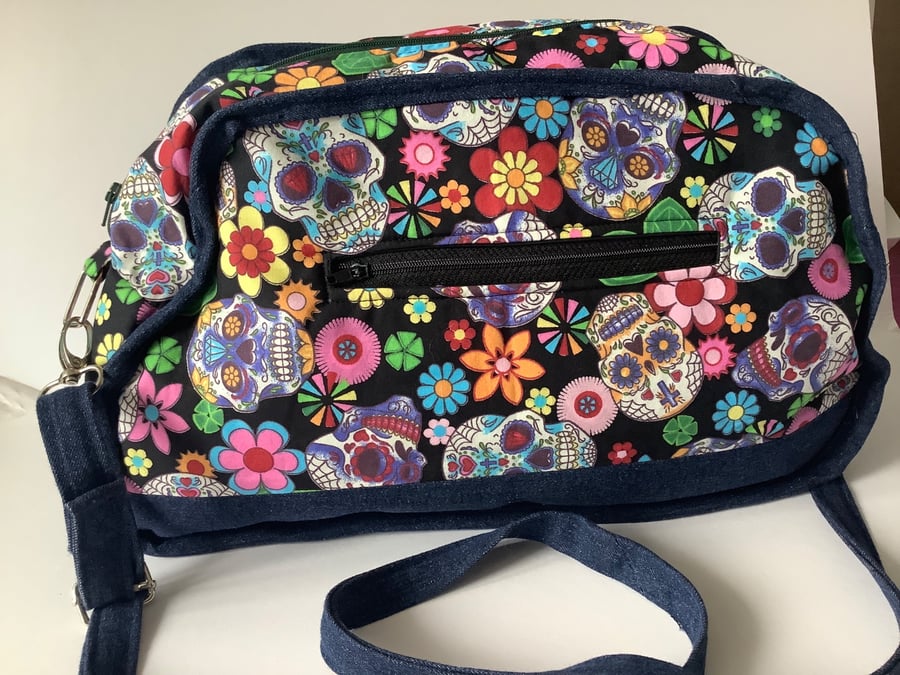 Hand made shoulder bag using repurposed denim and cotton candy skull fabric