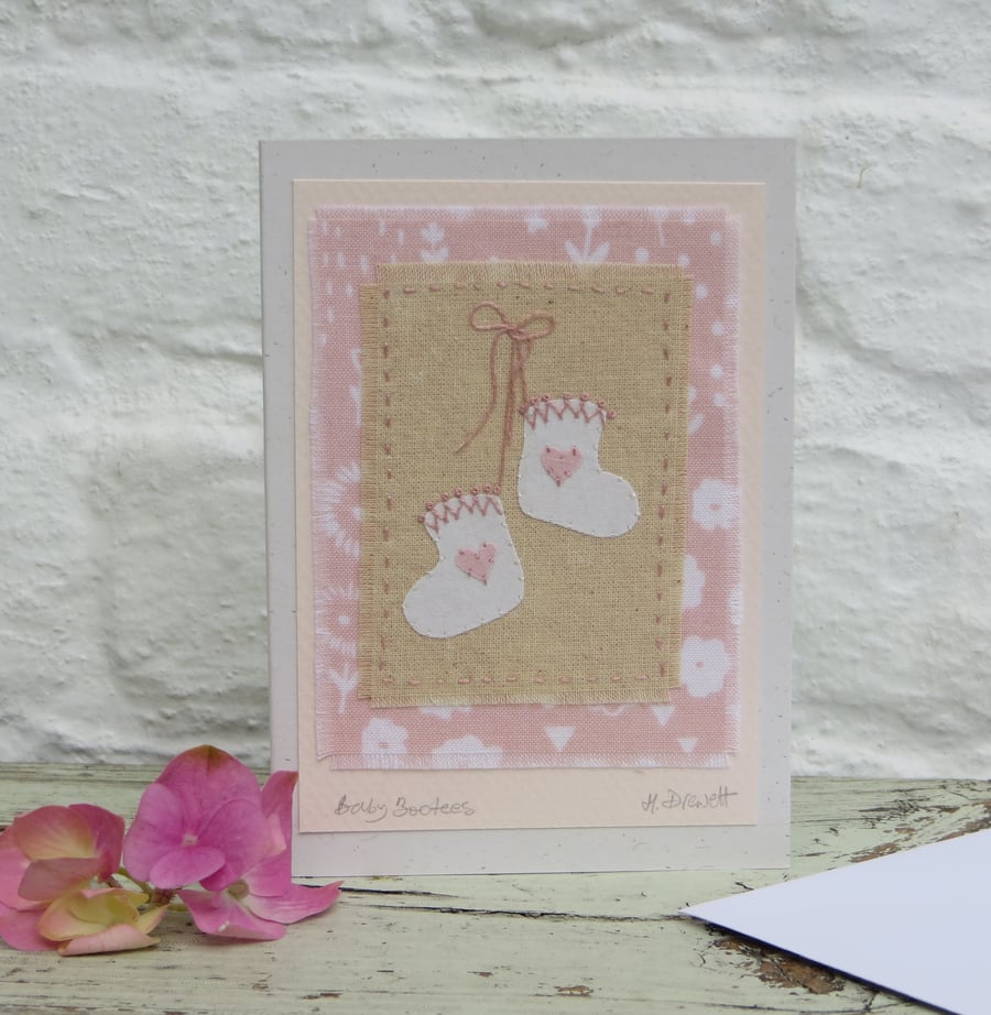Pretty hand-stitched baby bootees with hearts and bow - very sweet!